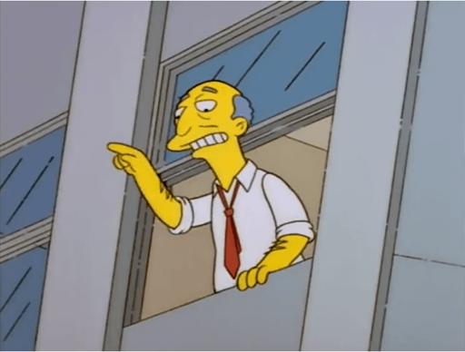 a man looks out a window and points off to the side. he is wearing a business shirt and a tie. 