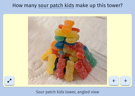 A screenshot of the daily game Estimate Me showing a picture of a tower of sour patch kids candies